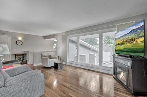 Living room with newer windows allowing an abundance of light.
