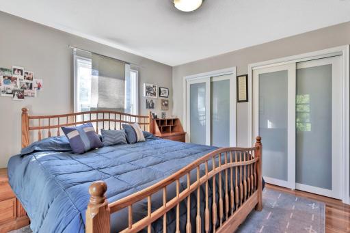 Additional view of the primary bedroom with new closet doors.