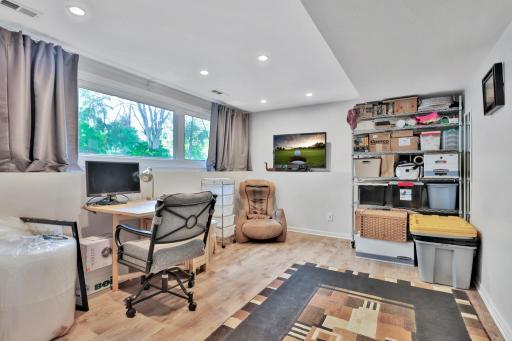 Lower level bedroom used for office and storage.