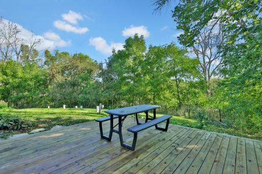 Back yard wood deck behind garage.