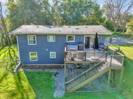 Private back yard with Trex Deck, aluminum rails and spindles and steps down to back yard.