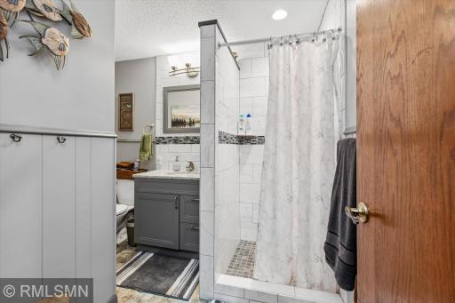 Remodeled lower level 3/4 bath- amazing tile work!