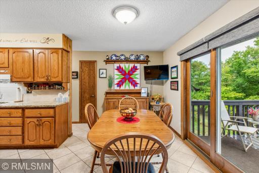 Dining area with patio door leading to the backyard deck.