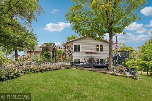 Front of home - lovely deck space to sit and enjoy the wildlife overlooking the private acreage.