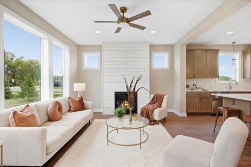 Shiplap surround floor to ceiling highlights the gas fireplace.
