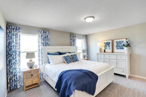 Primary bedroom has plenty of space to decorate to your liking! Model home, color and finish will vary.