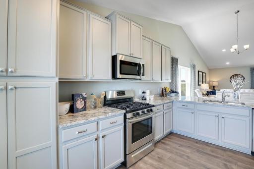 Lots of cabinets and storage. Model home, color and finish will vary.