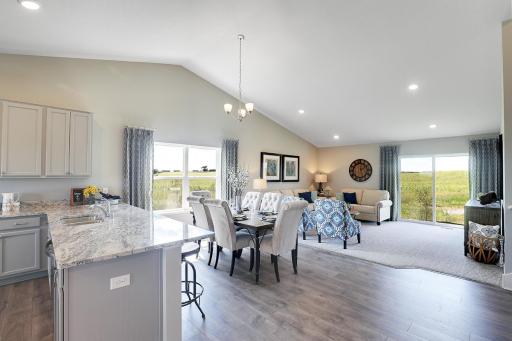 Wide open, vaulted ceilings, and cozy! Model home, color and finish will vary.