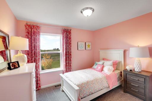 One of three upstairs bedrooms. Model home, color and finish will vary.