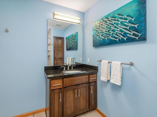 This 3/4 Bath is adjacent to the Family Room/Amusement area for added convenience!