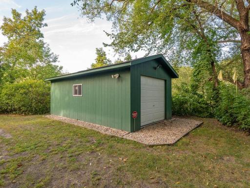 A single-stall garage/storage shed provides plenty of space for lawn and gardening equipment, kayaks and other outdoor gear.