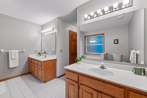 Spacious primary bath featuring a dual-sink vanity and plenty of counter and storage space