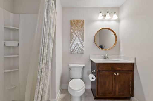 The 3/4 en suite bathroom offers a comfort-height vanity with quartz countertop.