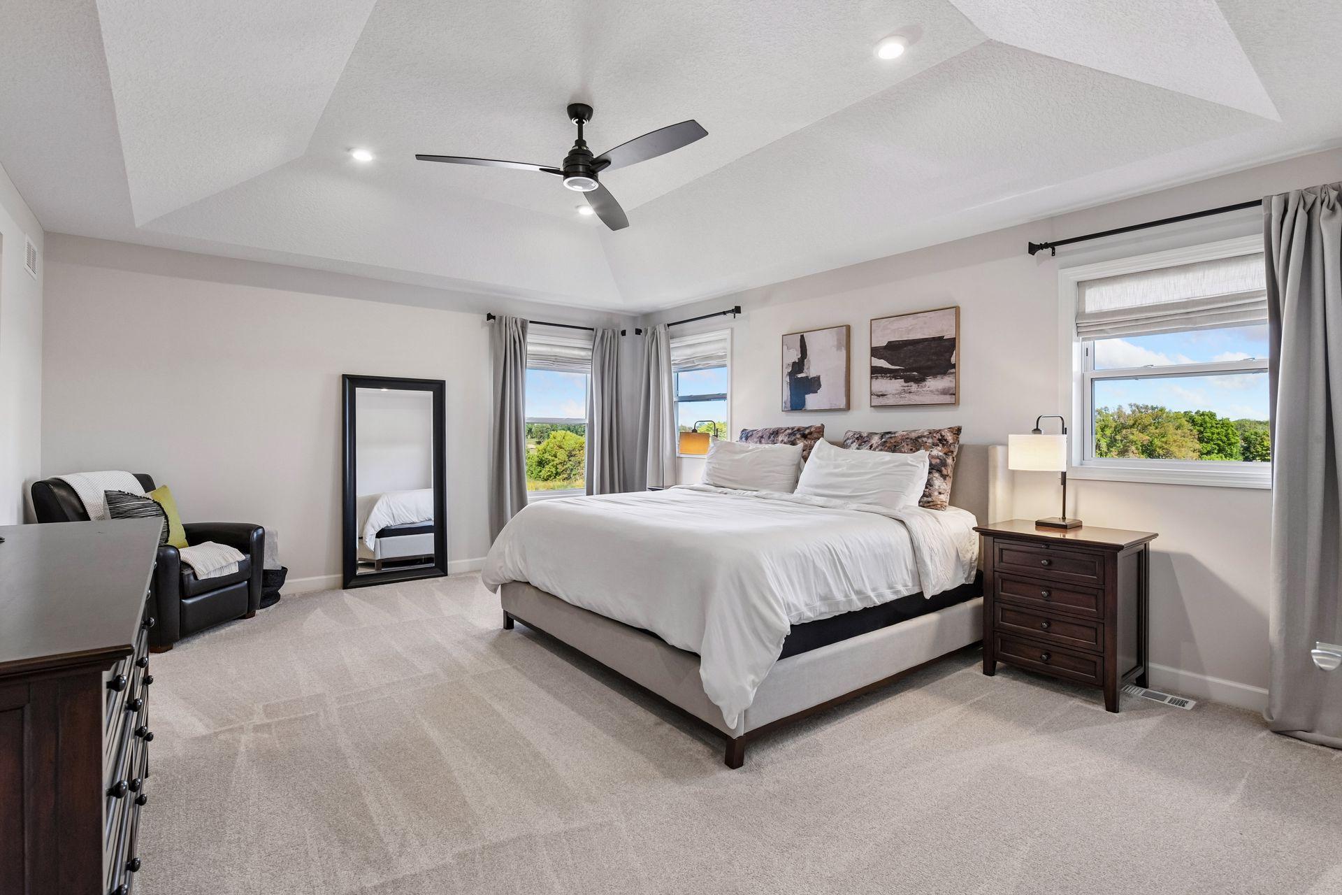 Upstairs you will find the spacious Primary Suite with a vaulted ceiling and separate His & Her walk-in closets.