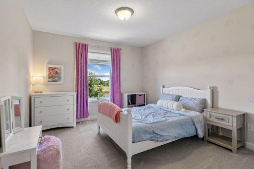 In addition to the Primary Suite, the upper level houses three Junior Bedroom.