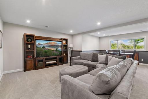 The living spaces are extended into the lower level where you will find a second family room - perfect for movie night!