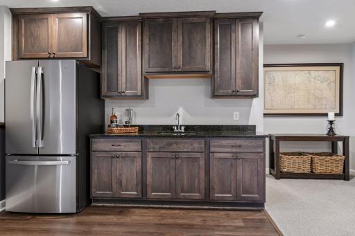 The walk-up wet bar is great for storing snacks and keeping your favorite beverages cold.