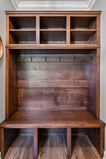 The Mud Room has been upgraded with a built-in hall tree, handy "drop station," and coat closet ensuring easy organization and convenience.