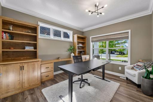 A dedicated Home Office sits behind glass French doors on the main level and offers custom built-in cabinetry, desk and bookshelves.