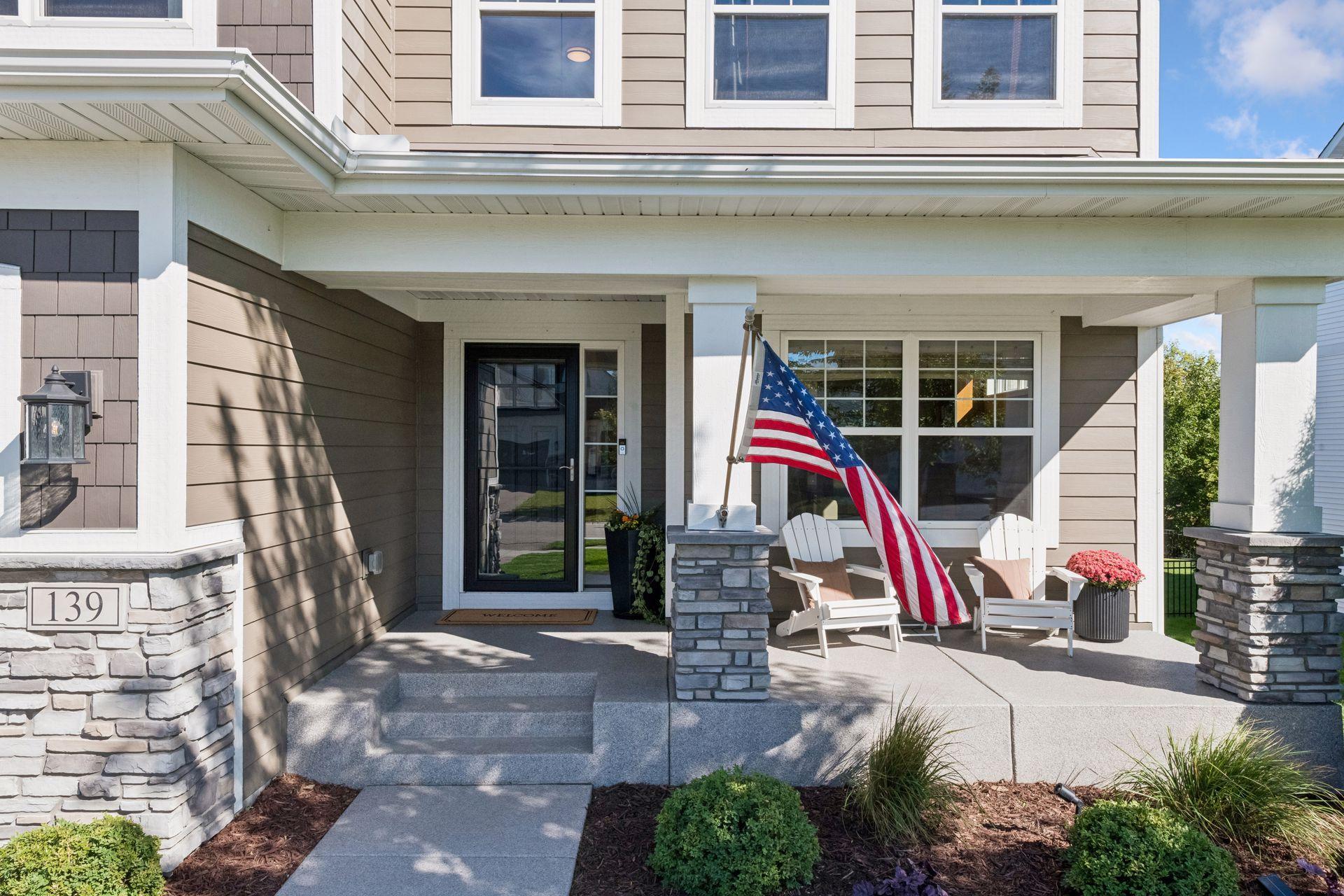 The front porch offers a simple spot to enjoy the neighborhood and the changing seasons.