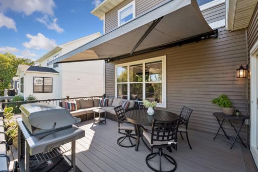 A motorized sunshade creates a comfortable space to relax on the deck.