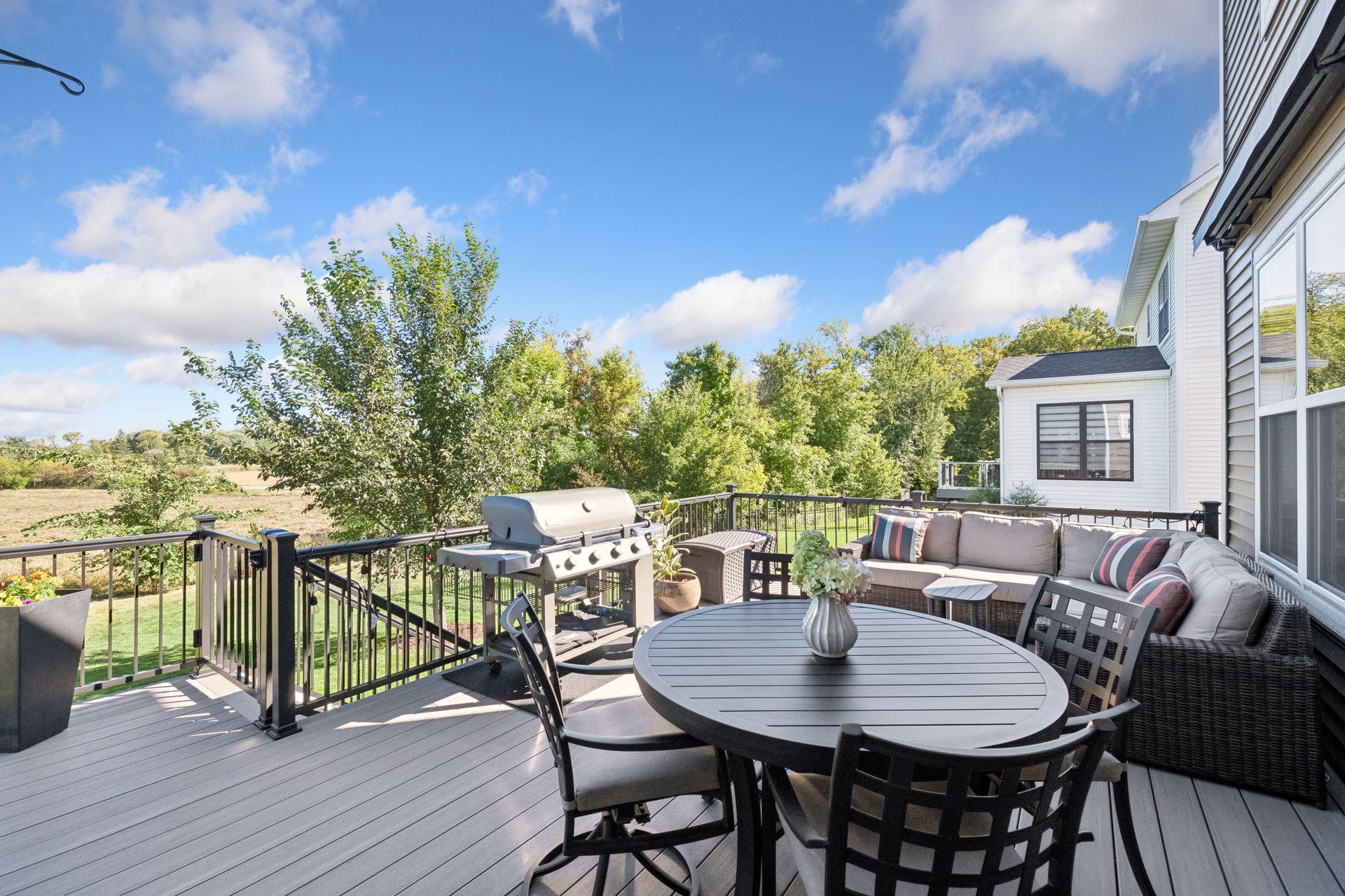 The sellers added a large, maintenance-free deck with steps down to the yard.