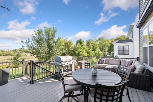 The sellers added a large, maintenance-free deck with steps down to the yard.
