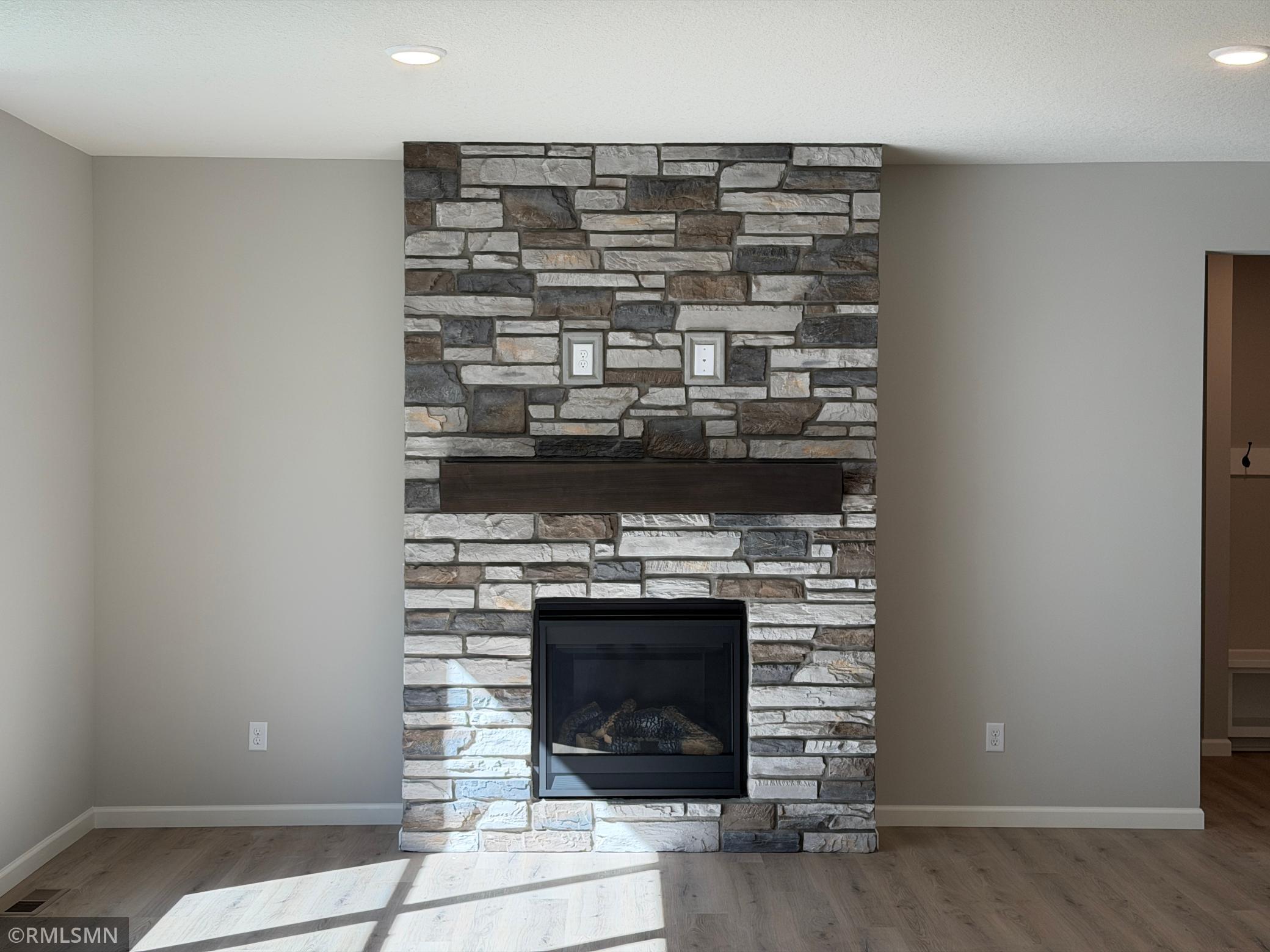 Gas fireplace with stone facade