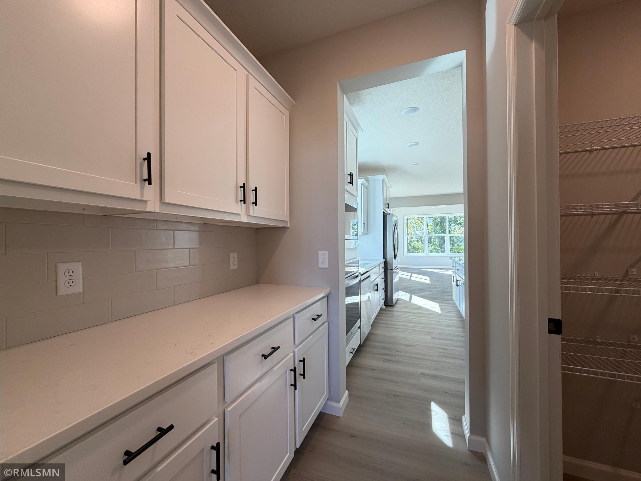 Butlers pantry with more cabinets and drawers