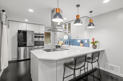 Quartz countertops and tiled backsplah