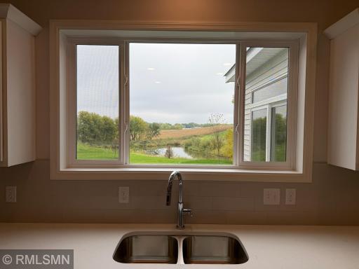 Perimeter sink with an huge kitchen window and great view