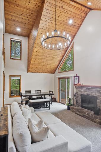 Look up! The warm wood-planked vaulted ceiling and statement chandelier create an impressive space with character from every angle.