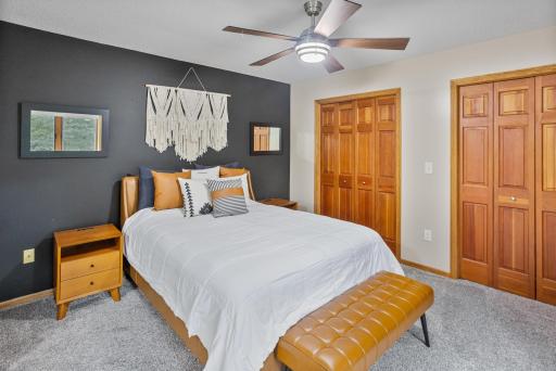 Two closets provide generous storage while warm wood doors add character.
