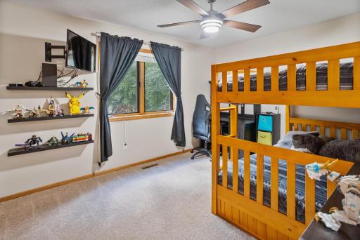A spacious second main-level bedroom with room for sleeping, studying and play.