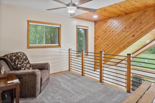 Open loft overlooks the great room, creating a cozy bonus space for reading, relaxing or a home office.