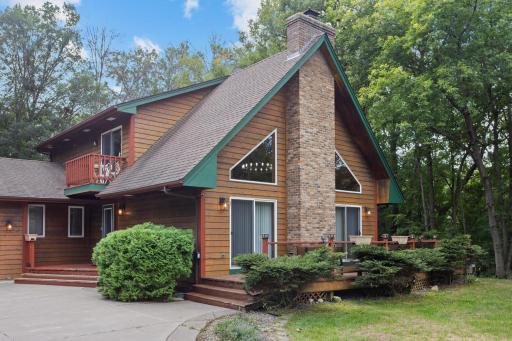 Warm wood siding, dramatic rooflines and expansive windows give this home its distinctive lodge-inspired character.