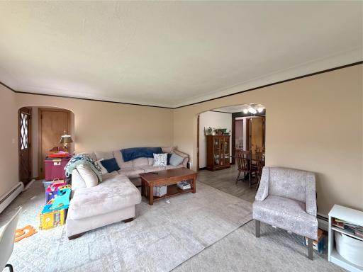 Comfortable living room features generous space for seating and an easy flow into the adjoining dining room, you'll love to entertain here.