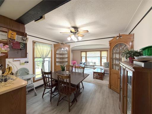 Spacious dining area offers plenty of room for a large table along with 2 built-in hutches and easy access to the adjoining kitchen.