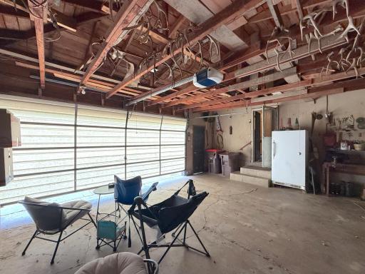Spacious double garage provides ample room for parking along with additional space for tools, storage and projects.