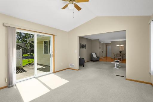 Plenty of natural light fills the Sunroom, with a sliding glass door leading directly to the patio.