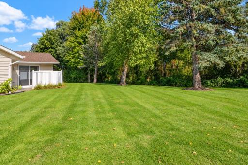 Mature trees behind the home create a nice semi-private backyard setting.