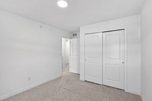 Each secondary bedroom includes premium wall-to-wall carpeting with 6 lb padding for enhanced comfort and a convenient closet