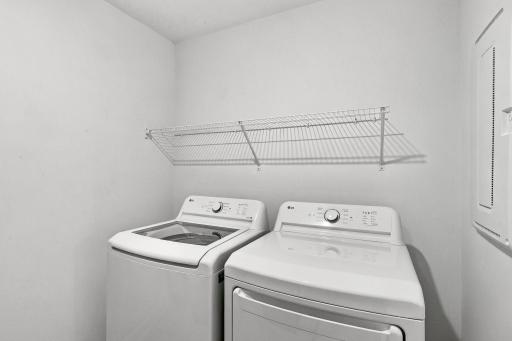 Ventilated shelving in the laundry room provide storage solutions to help simplify daily chores