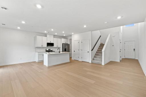 This Great Room is framed by windows to bathe the space in natural light