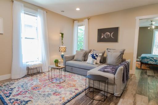 main level living room leading to 1st bedroom.jpg.jpg