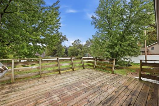 Spacious deck with peaceful backyard views, perfect for summer gatherings and quiet mornings outdoors.