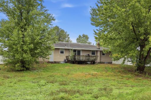 Large, maintenance-free fenced backyard with plenty of space to relax, play, garden, and entertain.