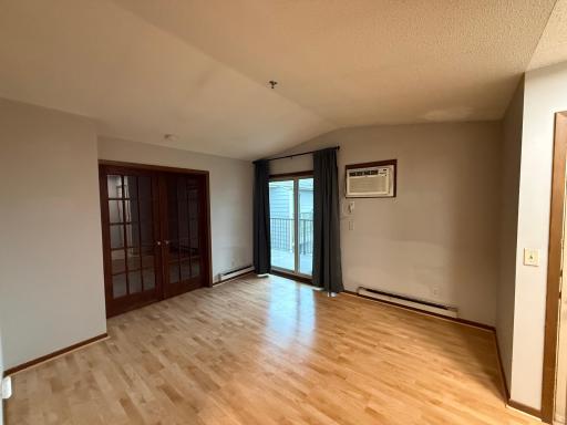 Vaulted Ceilings in this upper level unit!French doors lead to bedroom