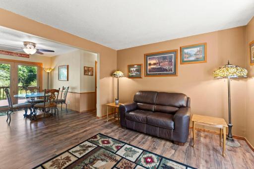 From from inside of living room, toward dining and hallway leading to bedrooms and main bathroom.