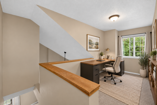 Versatile loft is ideal for a dedicated home office, reading area or flex space. Digitally Staged